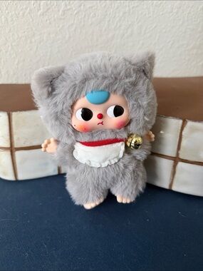 Baby Three 80% billionaire cat keychain with grey fur and bell